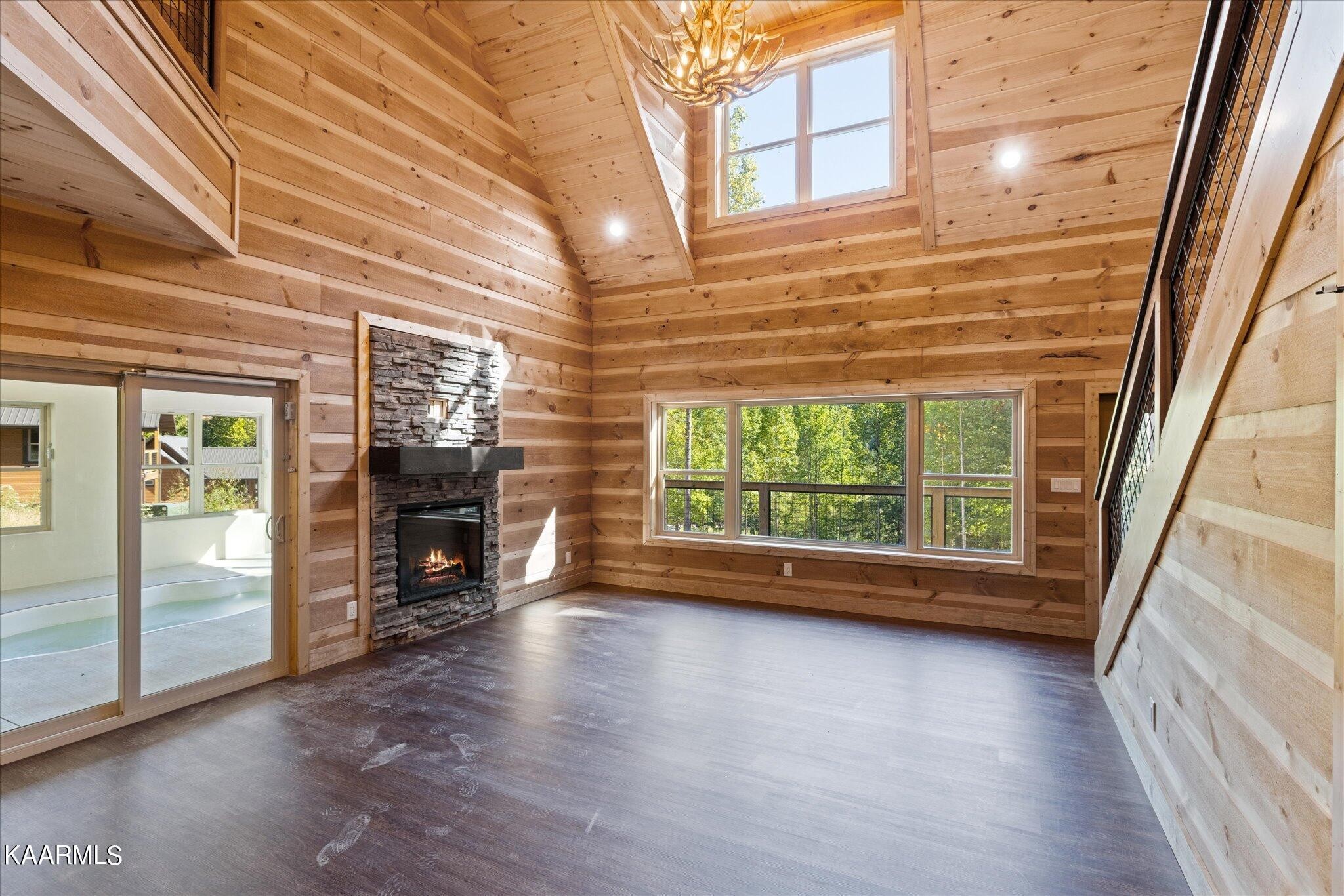 4228 Wears Valley Road, Unit 71 Sevierville, TN 37862 - Photo 6 of 28 a view of empty room with wooden floor and fireplace