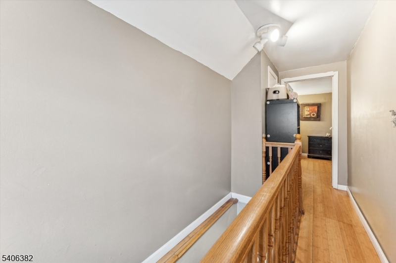39-27 Taylor Road Fair Lawn, NJ 07410 - Photo 16 of 27 a view of a hallway with wooden floor