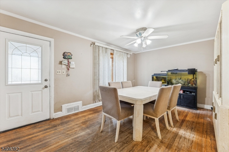 39-27 Taylor Road Fair Lawn, NJ 07410 - Photo 5 of 27 a view of a dining room with furniture window and wooden floor