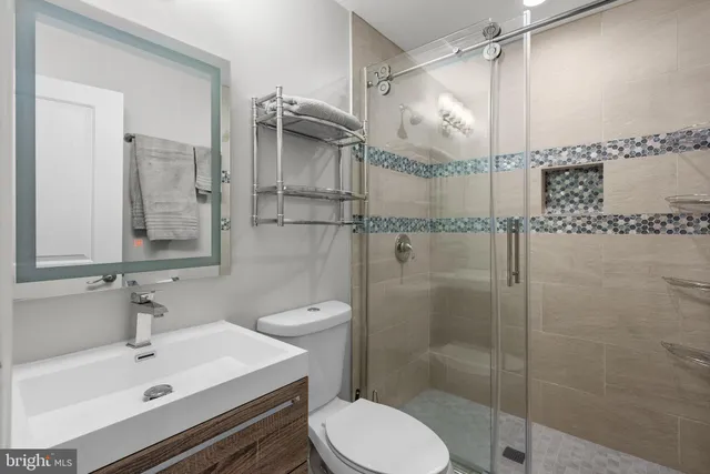 a bathroom with a shower and toilet