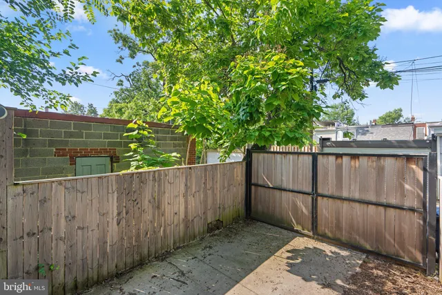a front view of house with yard and outdoor seating