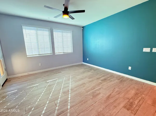 a view of an empty room with a window