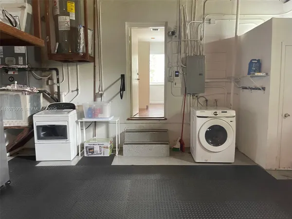 a utility room with dryer and washer