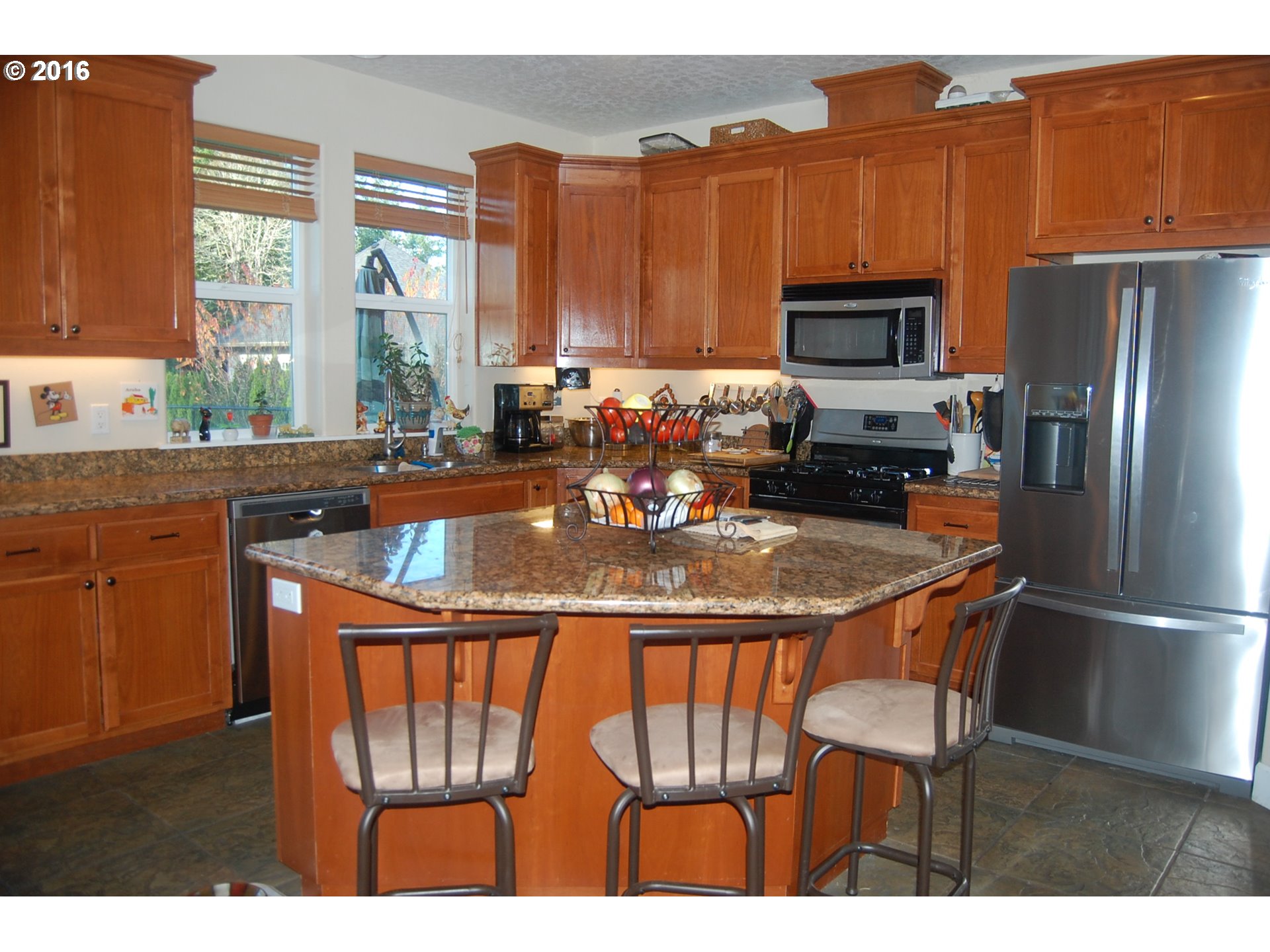 8325 Buffalo Lane Grand Ronde, OR 97347 - Photo 6 of 24 a kitchen with a refrigerator a stove a sink and a microwave