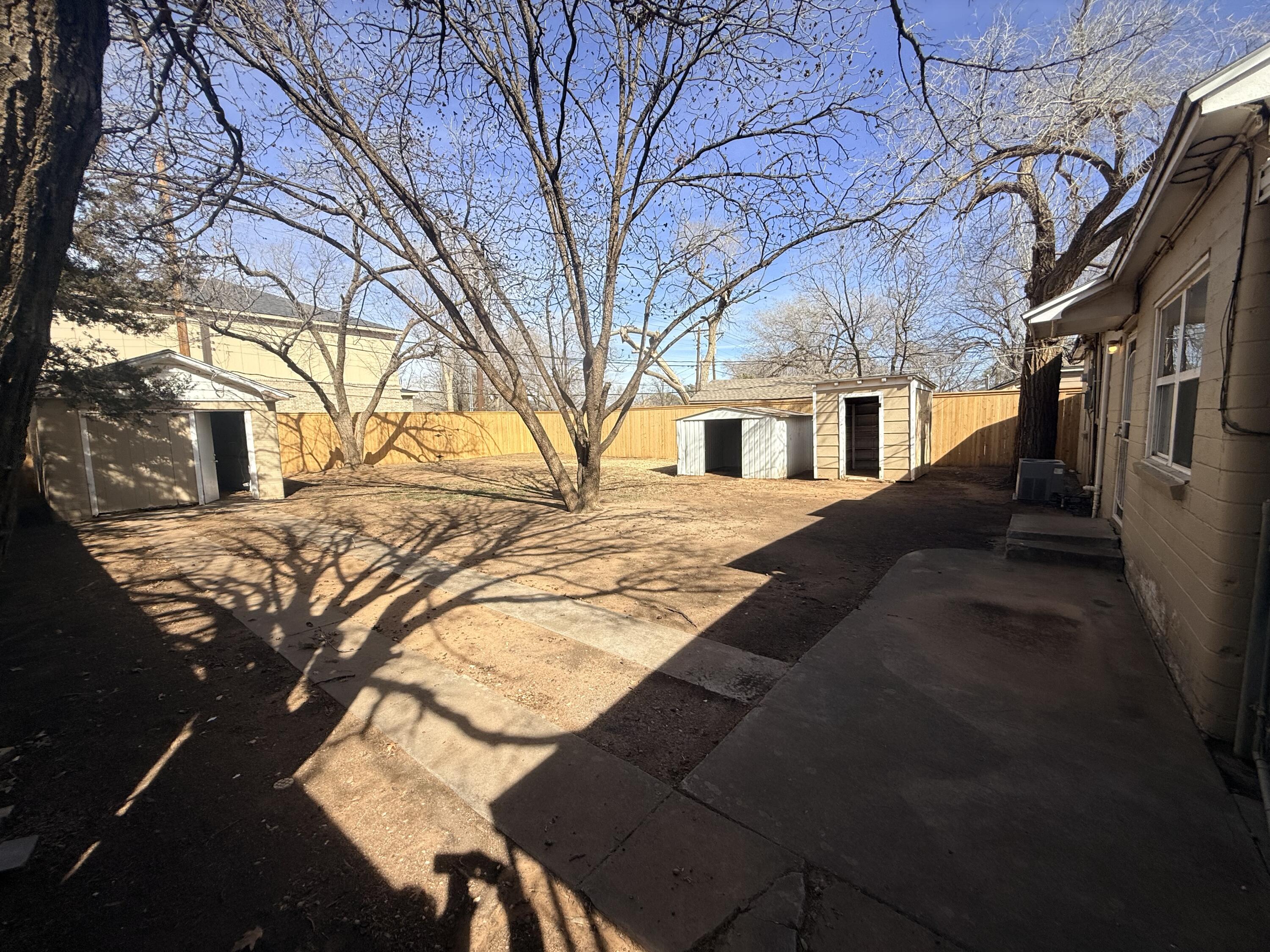 3418 25th Street Lubbock, TX 79410 - Photo 12 of 14 a view of a house with snow on the wall