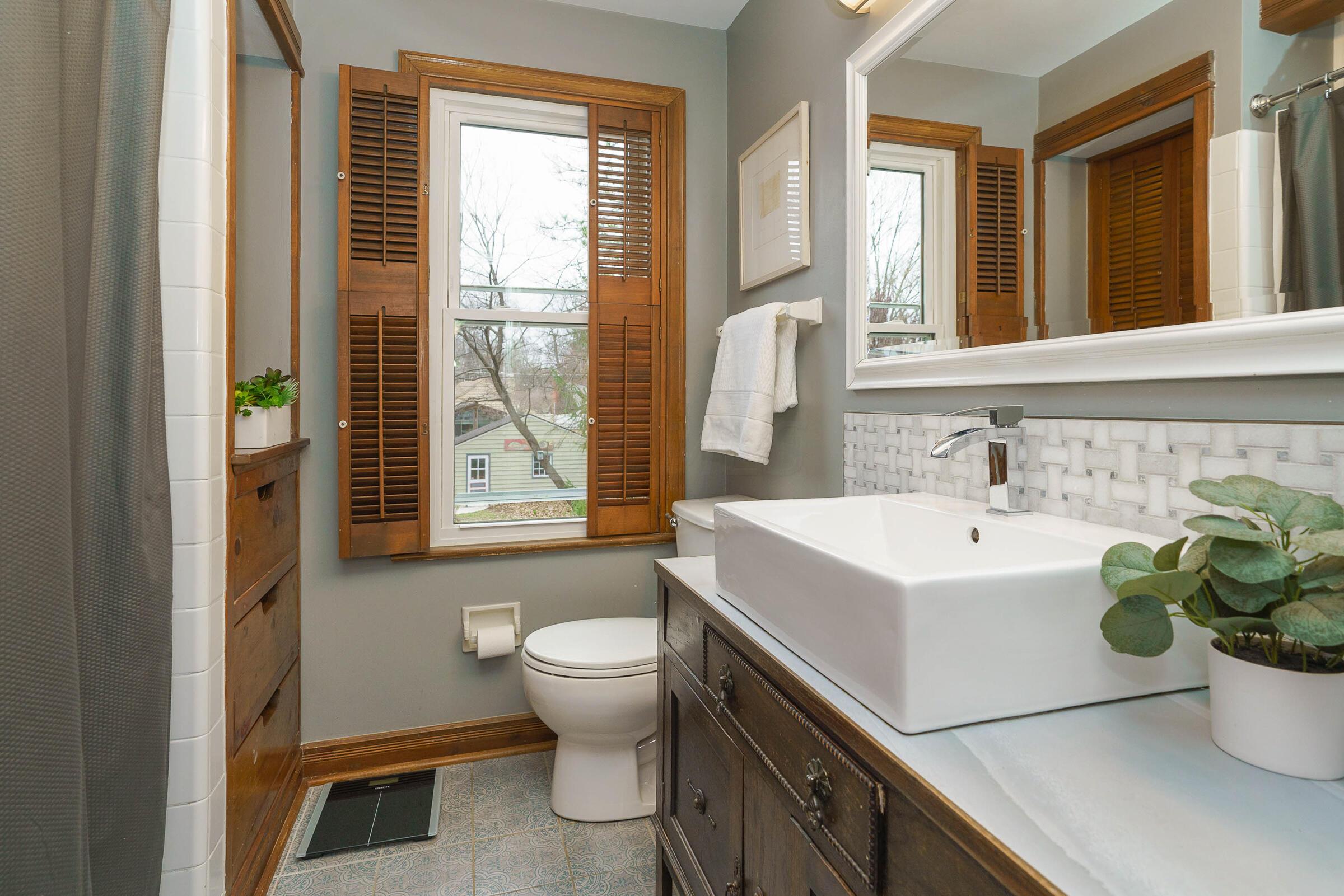 408 Midgard Road Columbus, OH 43202 - Photo 27 of 46 Updated in 2021, the 2nd floor full bath features a custom vessel sink and handsome cabinetry.