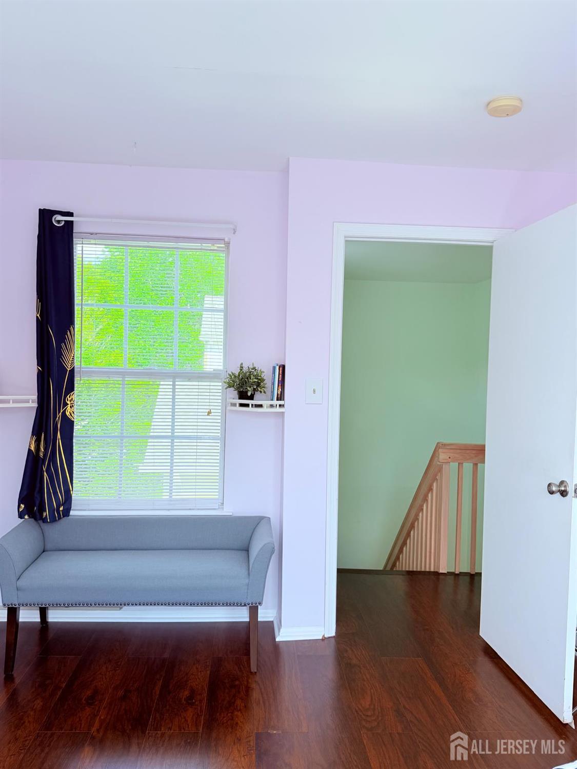 918 Plymouth Road North Brunswick, NJ 08902 - Photo 24 of 30 a view of a room with a window and a wooden floor