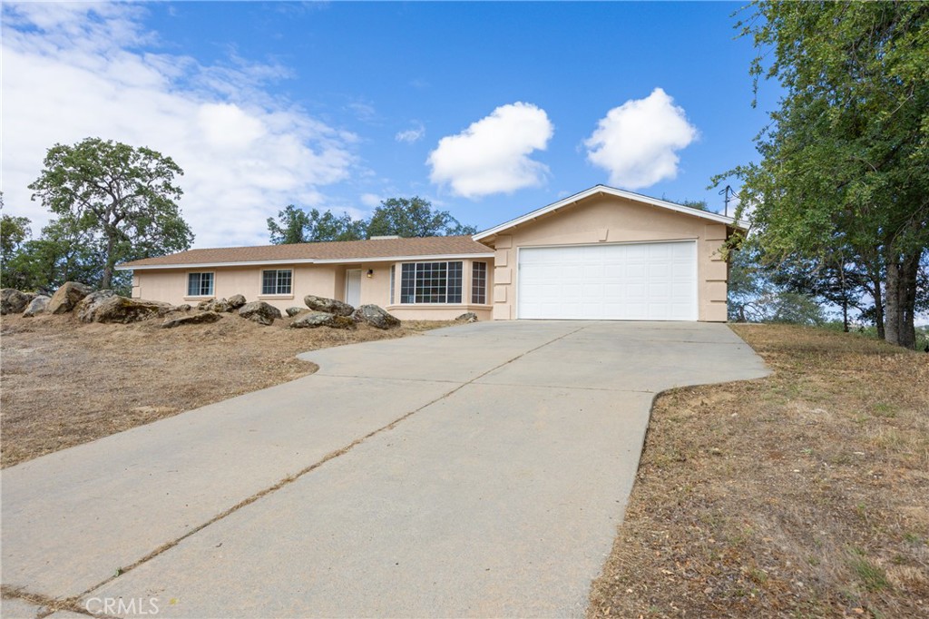30142 Revis Road Coarsegold, CA 93614 - Photo 37 of 43 a view of house with yard and entertaining space