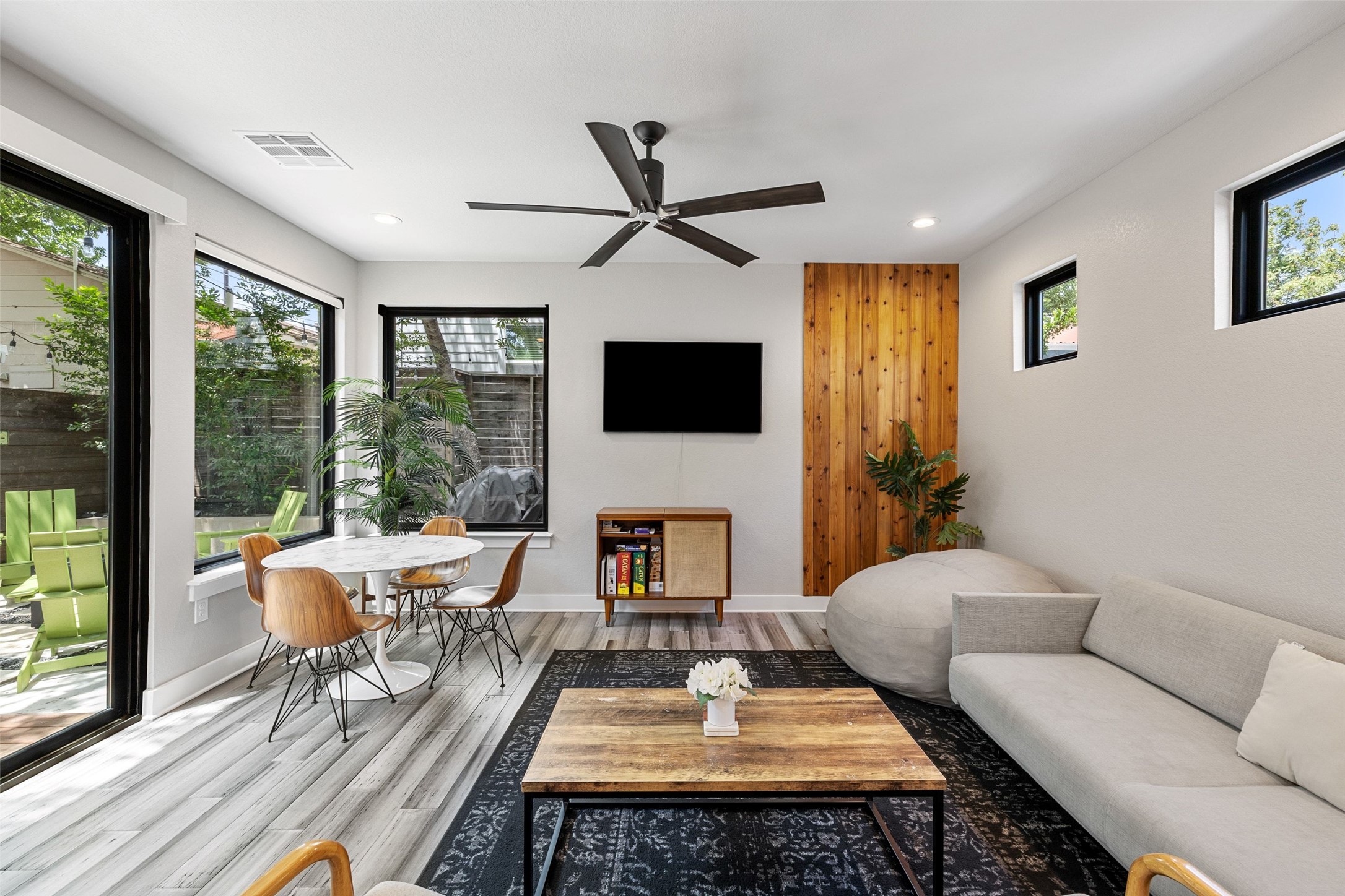 2202 Santa Rita Street Austin, TX 78702 - Photo 5 of 40 Living room downstairs with tons of natural light and large patio sliders out to backyard