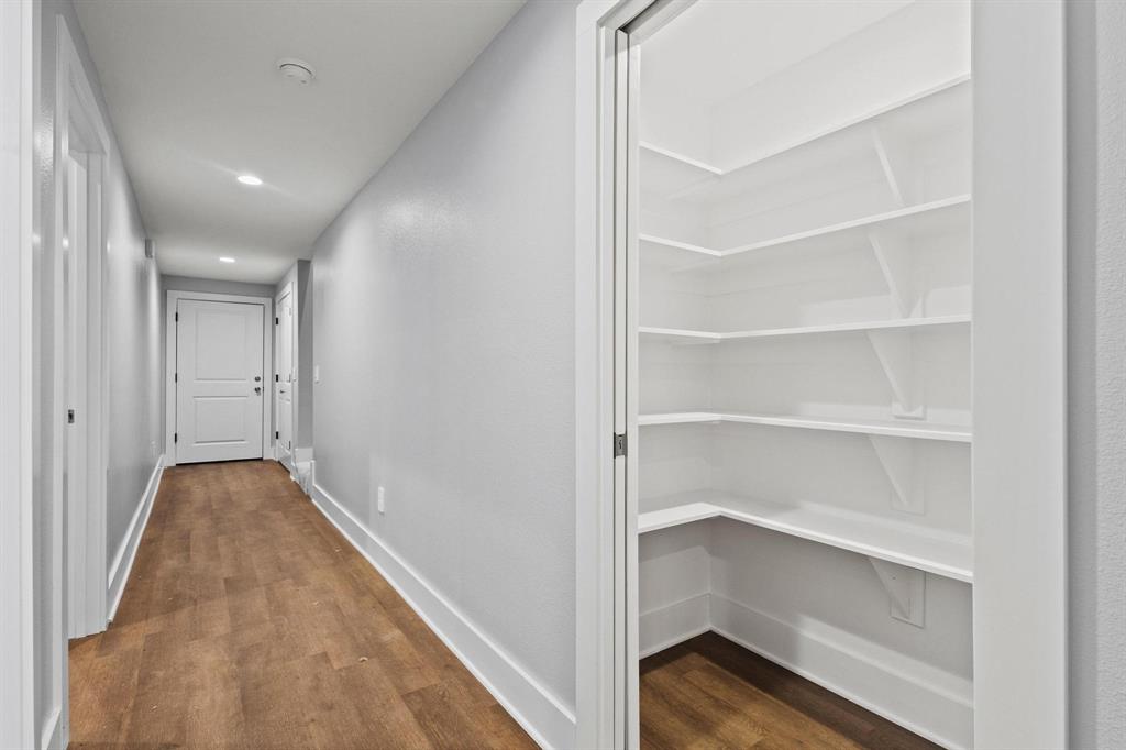 724 West Gandy Street Denison, TX 75020 - Photo 14 of 31 a view of a hallway with closet