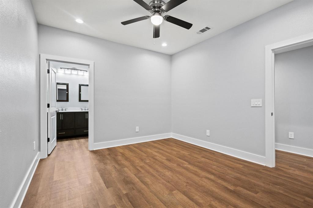 724 West Gandy Street Denison, TX 75020 - Photo 17 of 31 wooden floor in an empty room with a window