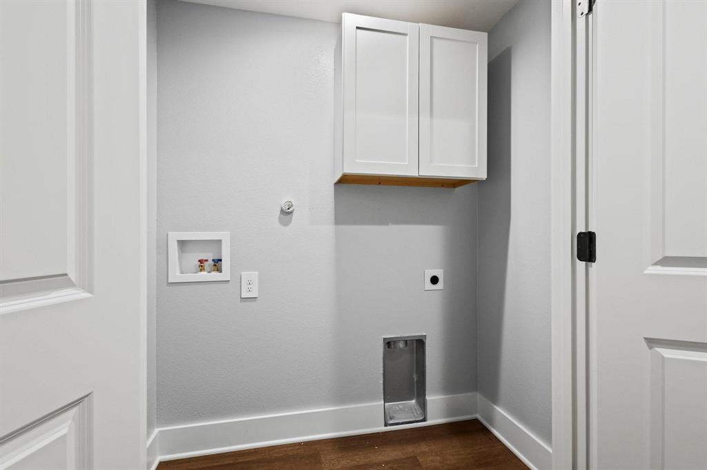 724 West Gandy Street Denison, TX 75020 - Photo 22 of 31 a view of an entryway with wooden floor