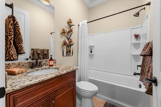 a room with a bed and a chandelier