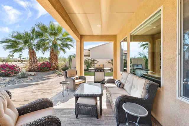 a view of a patio with a chairs and table and chairs