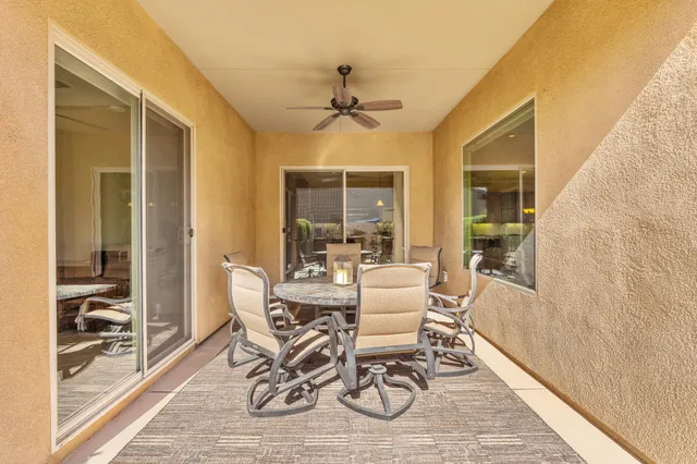 a view of a chairs and table on the terrace