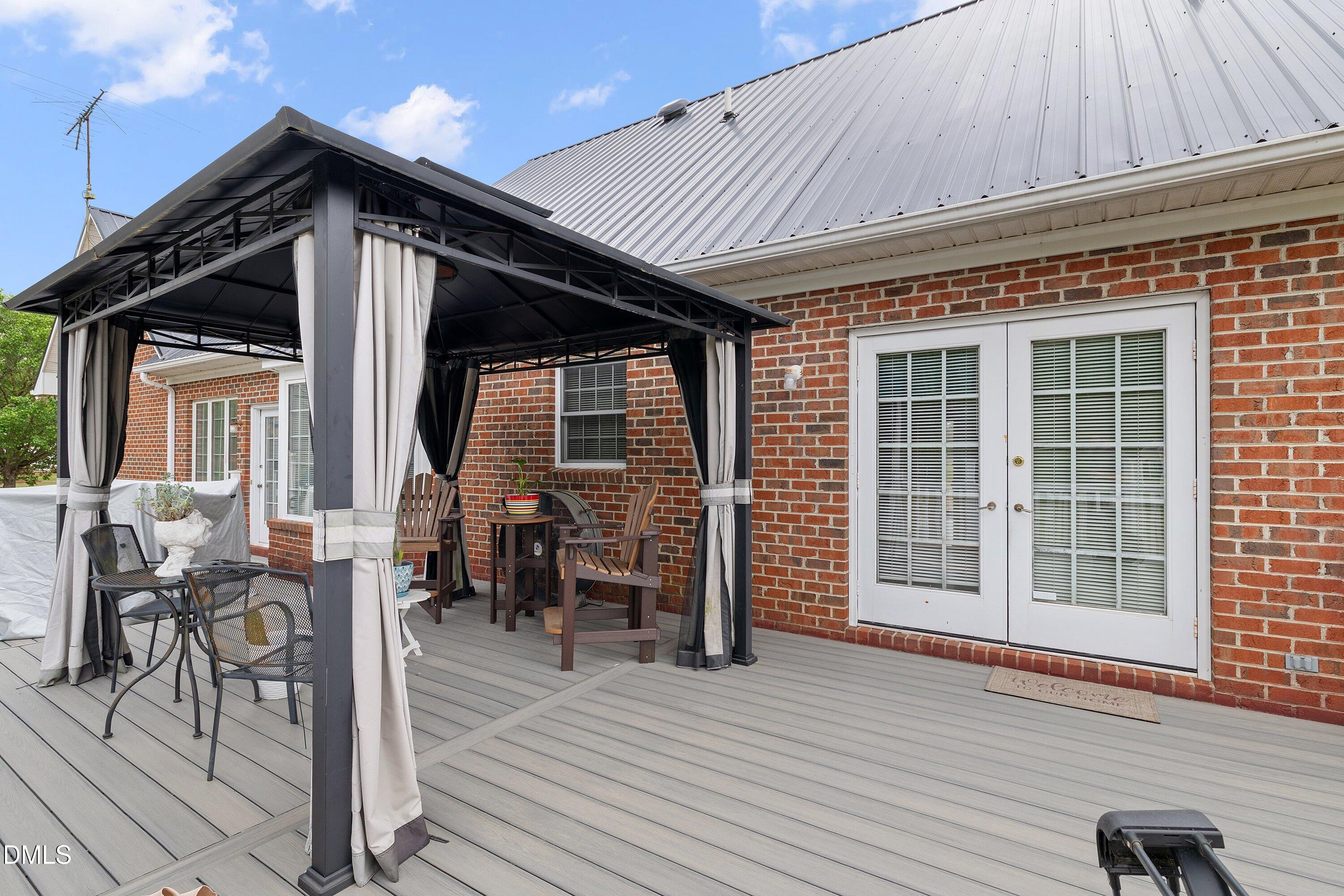 6314 Old Davis Road Sims, NC 27880 - Photo 57 of 71 a front view of a house with outdoor seating
