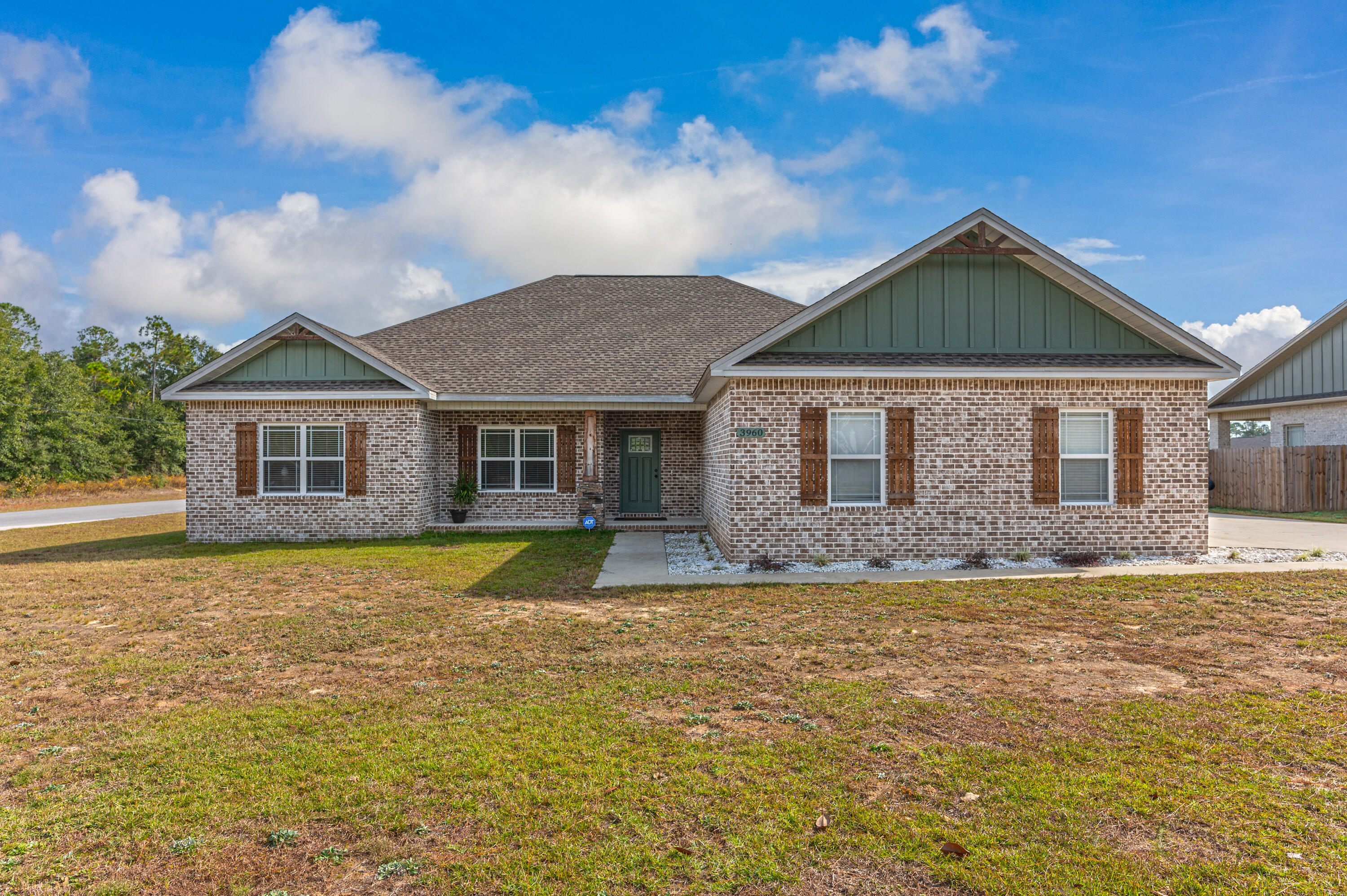3960 Painter Branch Road Crestview, FL 32539 - Photo 1 of 46 a front view of a house with a yard