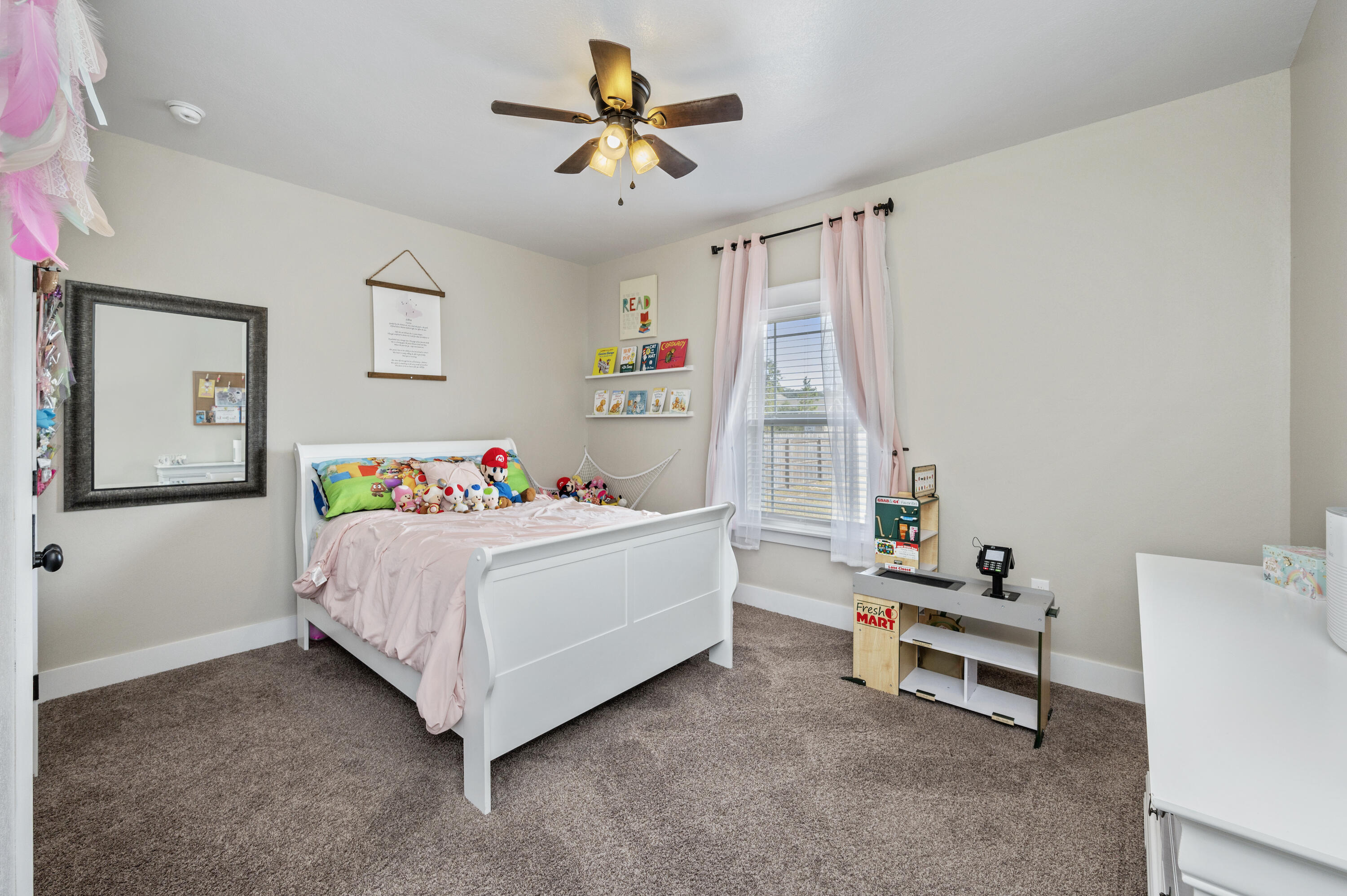 3960 Painter Branch Road Crestview, FL 32539 - Photo 24 of 46 a room with a bed and a ceiling fan