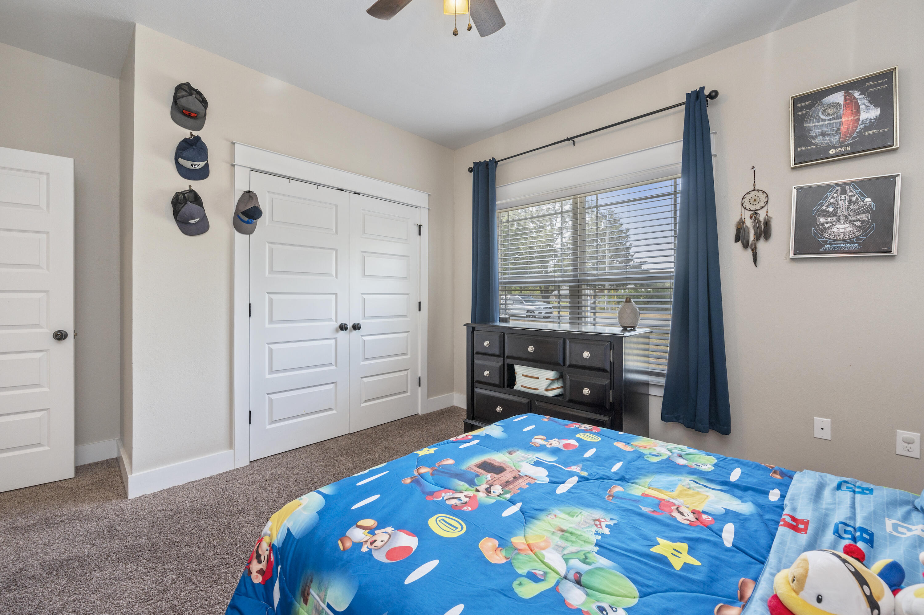 3960 Painter Branch Road Crestview, FL 32539 - Photo 29 of 46 a bedroom with a bed and a dresser next to a window