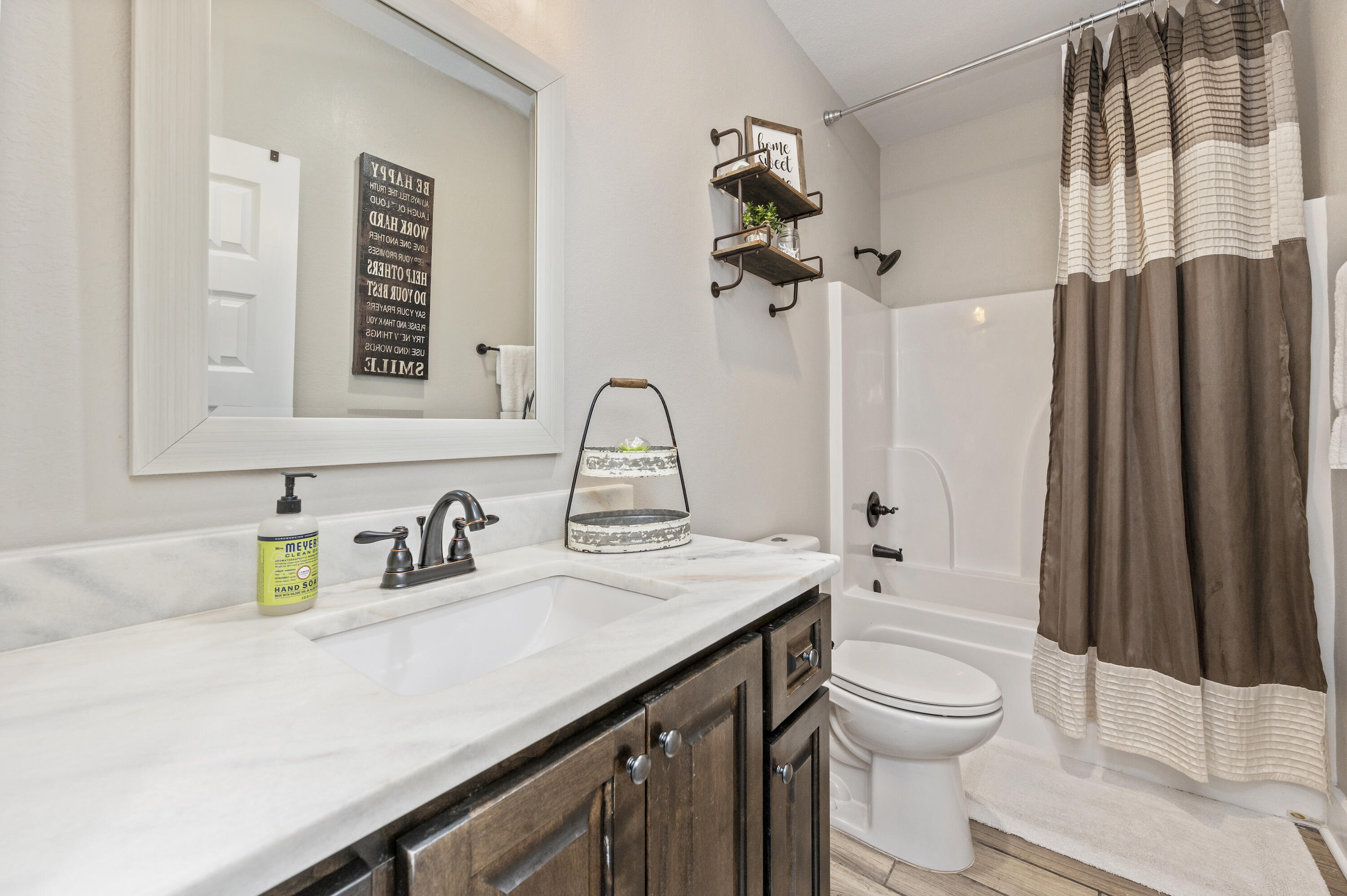 3960 Painter Branch Road Crestview, FL 32539 - Photo 30 of 46 a bathroom with a sink a toilet and shower