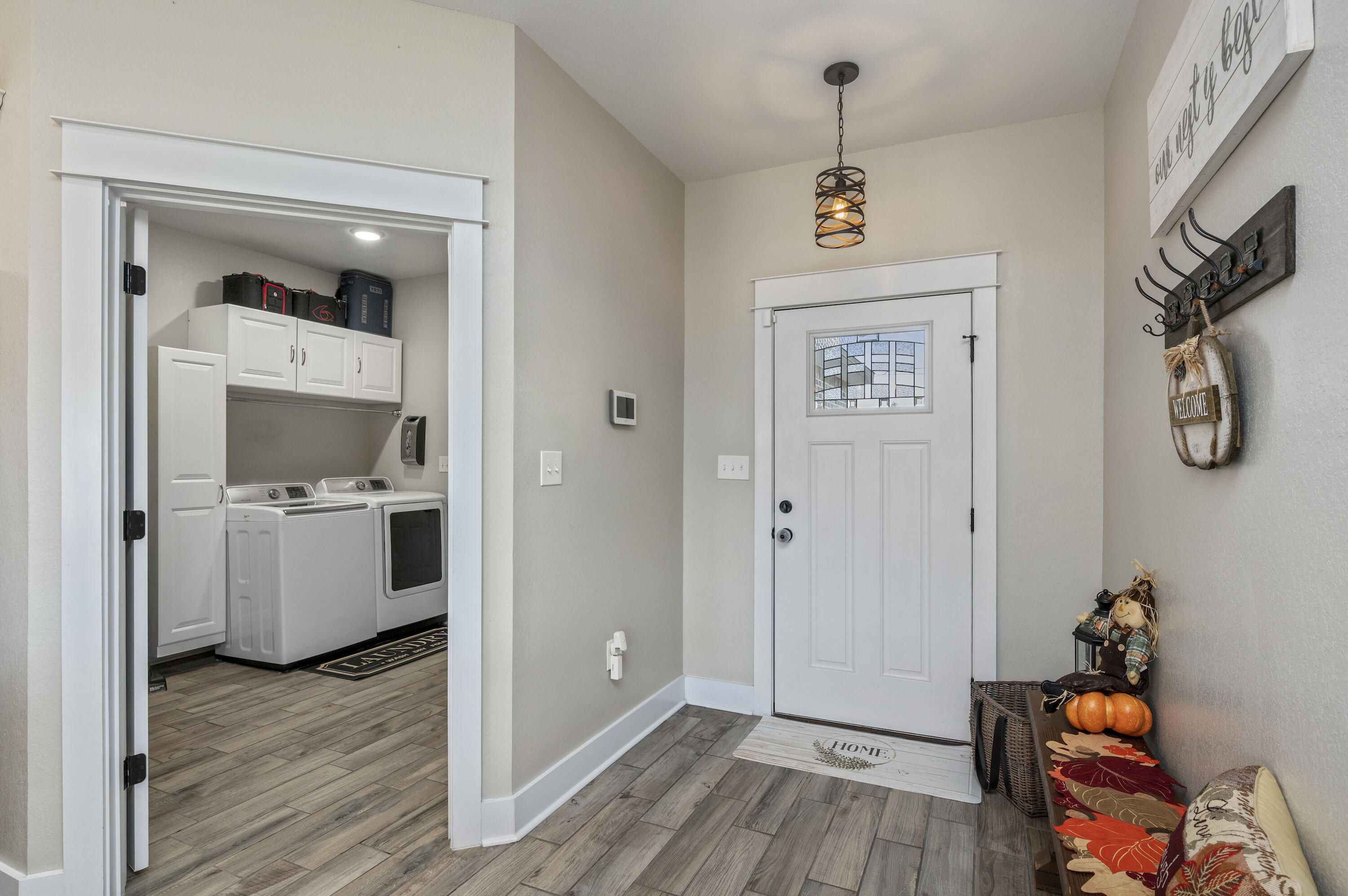 3960 Painter Branch Road Crestview, FL 32539 - Photo 4 of 46 a view of a hallway with wooden floor and closet