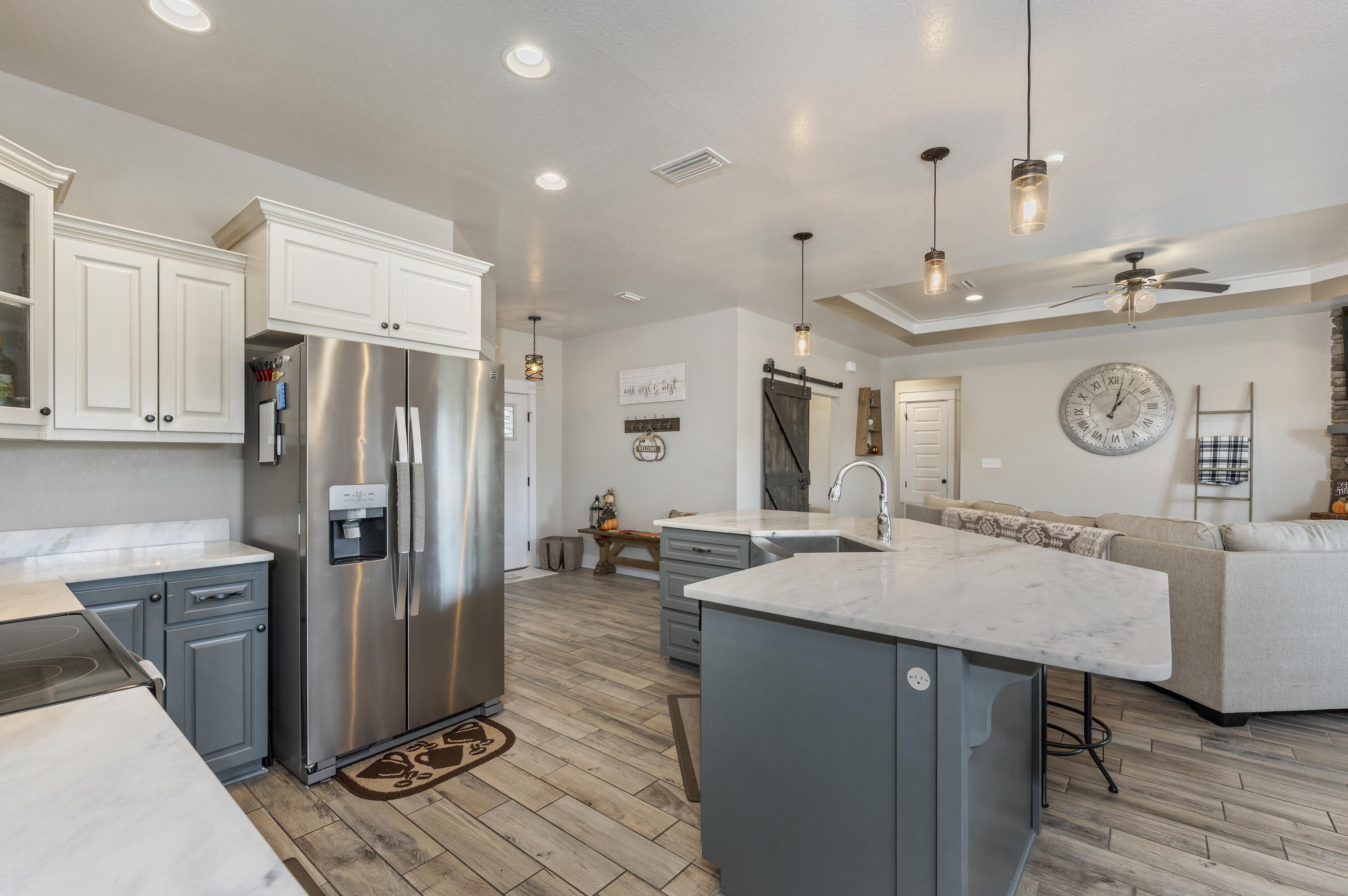 3960 Painter Branch Road Crestview, FL 32539 - Photo 9 of 46 a kitchen with stainless steel appliances granite countertop a sink refrigerator and cabinets