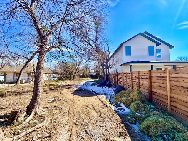 a view of a backyard of the house