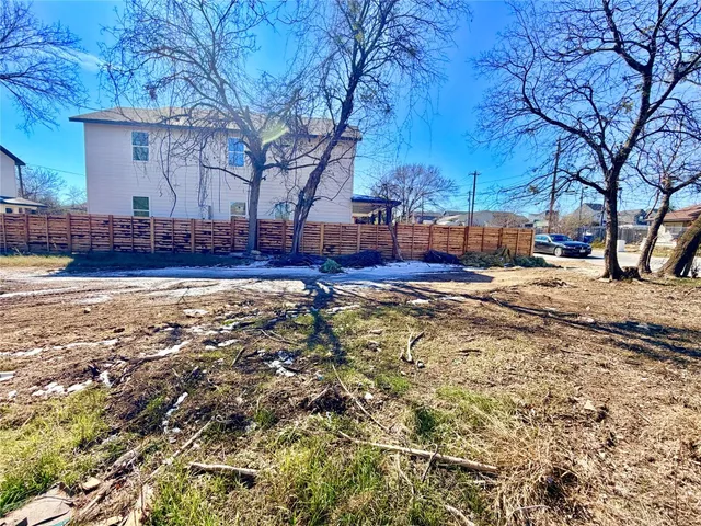 a view of a yard with trees