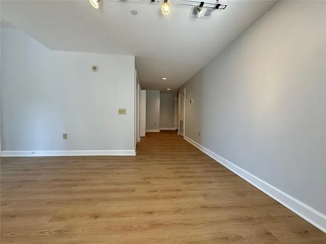 a living room with furniture a large window and a table