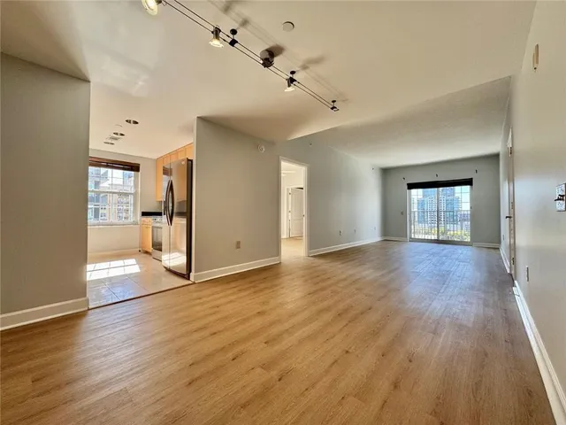 a view of a dining room with furniture and a window