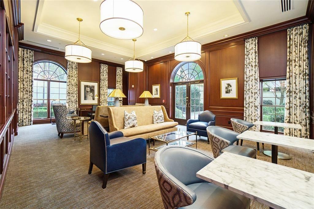 195 14th Street Northeast, Unit 1501 Atlanta, GA 30309 - Photo 38 of 47 a living room with fireplace furniture and a large window