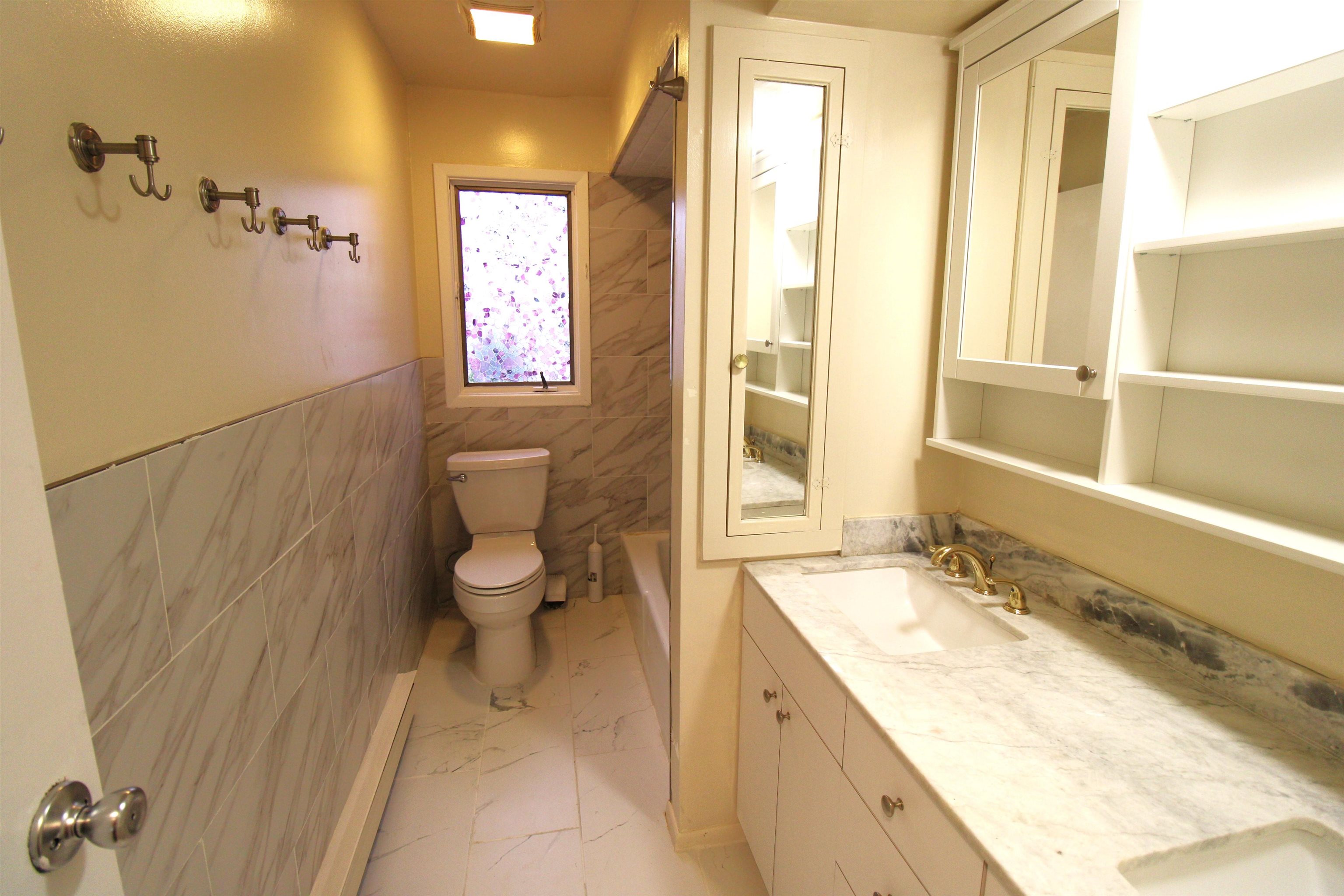 762 5th Street, Unit 1 Secaucus, NJ 07094 - Photo 12 of 27 a spacious bathroom with a granite countertop sink a toilet and a shower