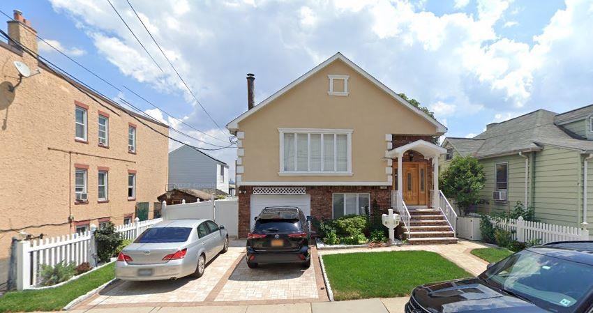 762 5th Street, Unit 1 Secaucus, NJ 07094 - Photo 13 of 27 a front view of a house with a yard