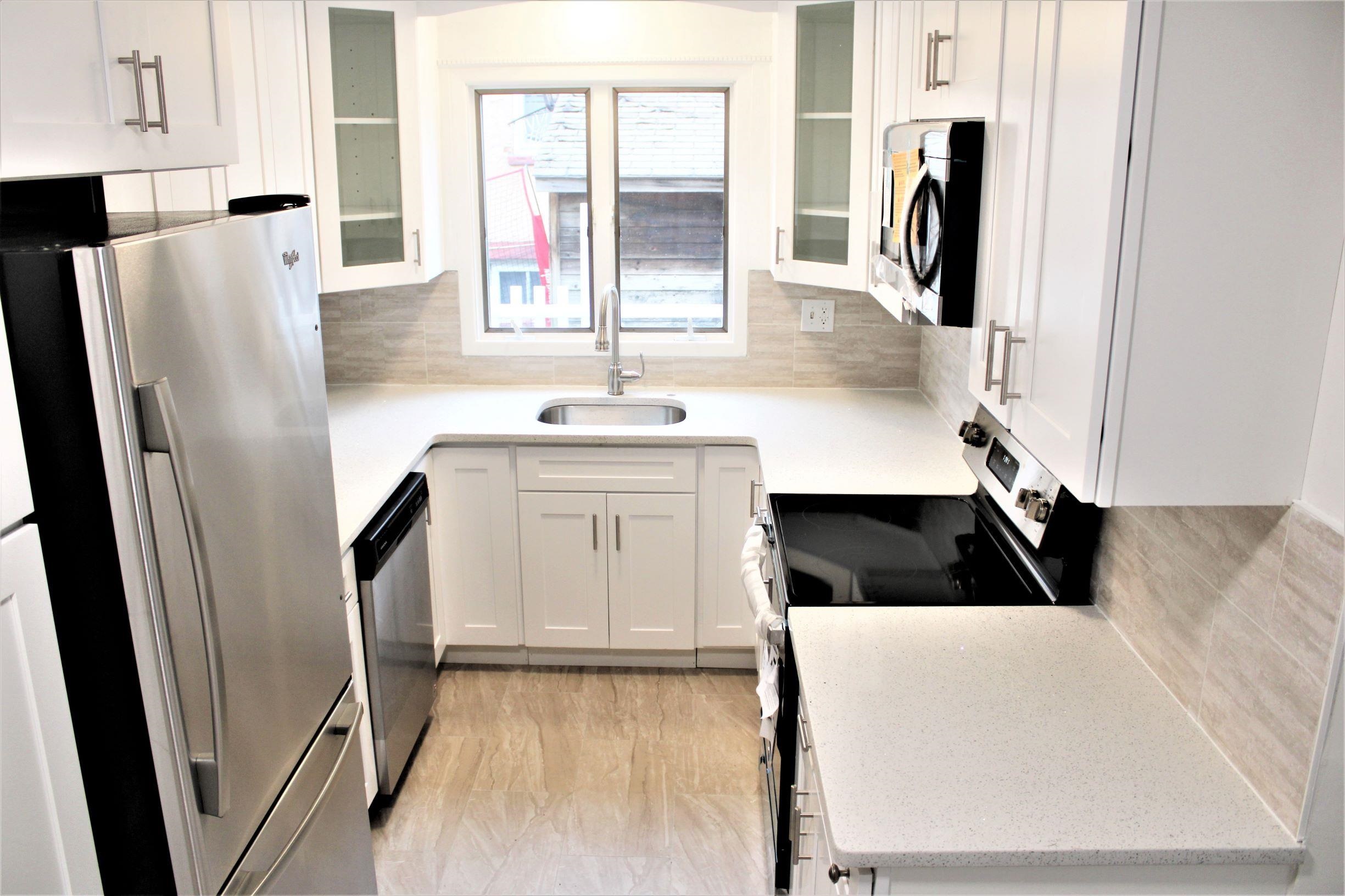 762 5th Street, Unit 1 Secaucus, NJ 07094 - Photo 2 of 27 a kitchen with a refrigerator a sink and a window