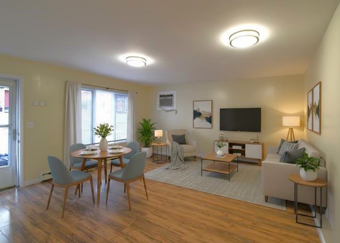 762 5th Street, Unit 1 Secaucus, NJ 07094 - Photo 3 of 27 a living room with furniture a window and a flat screen tv