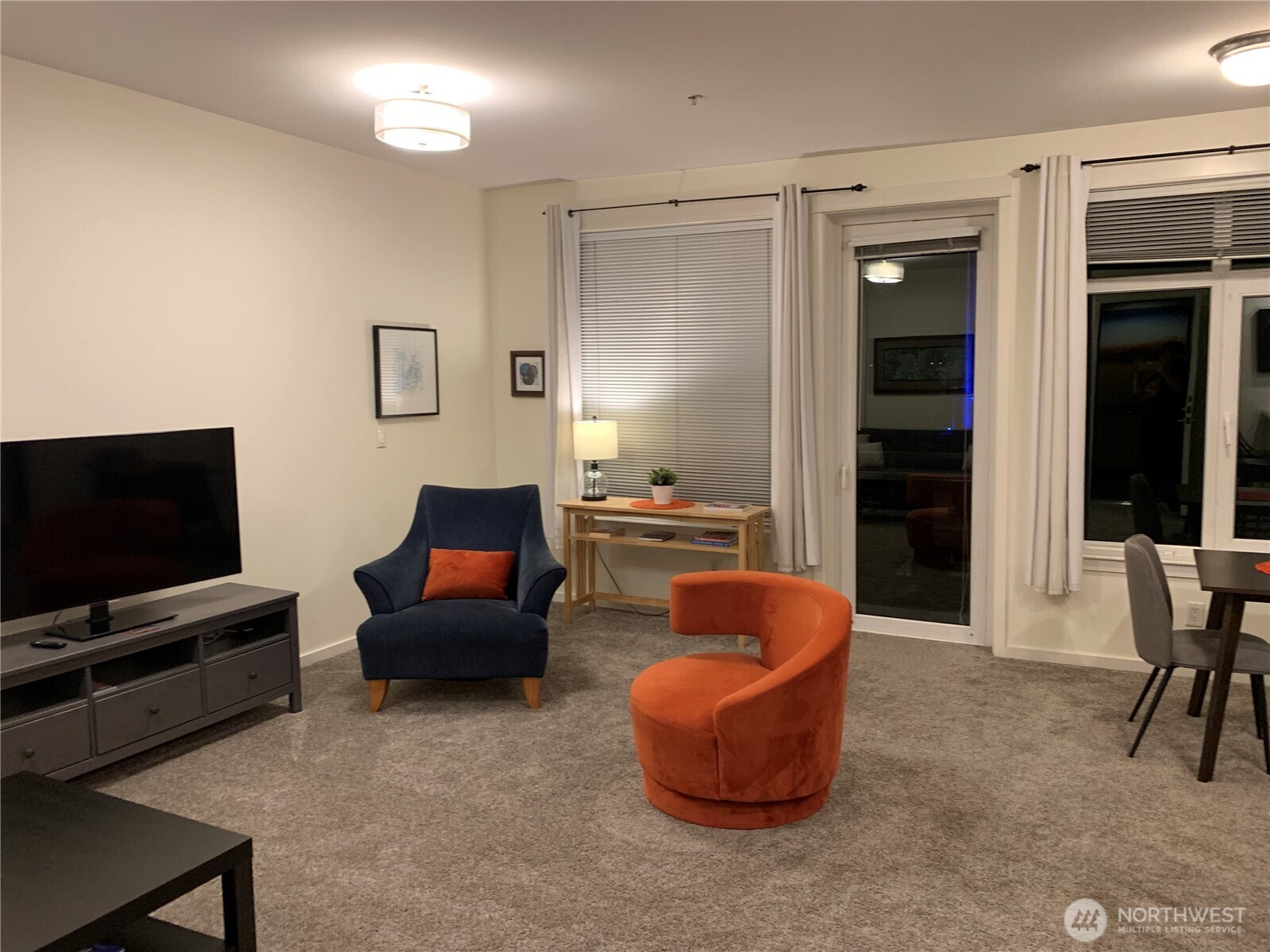 2000 Alaskan Way, Unit 342 Seattle, WA 98121 - Photo 11 of 40 a living room with furniture and a flat screen tv