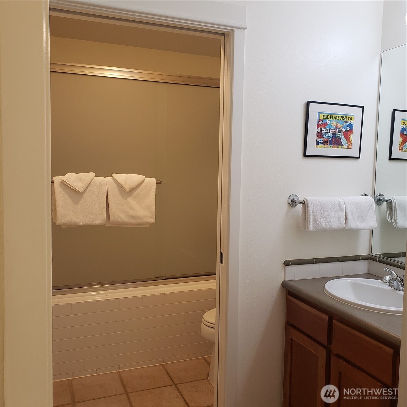 2000 Alaskan Way, Unit 342 Seattle, WA 98121 - Photo 21 of 40 a bathroom with a sink and mirror