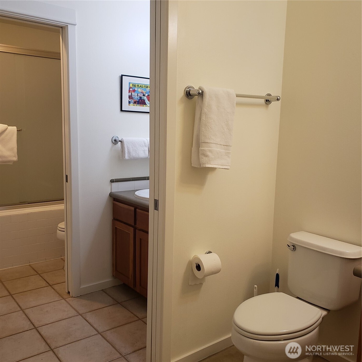 2000 Alaskan Way, Unit 342 Seattle, WA 98121 - Photo 24 of 40 a bathroom with a granite countertop toilet and a sink
