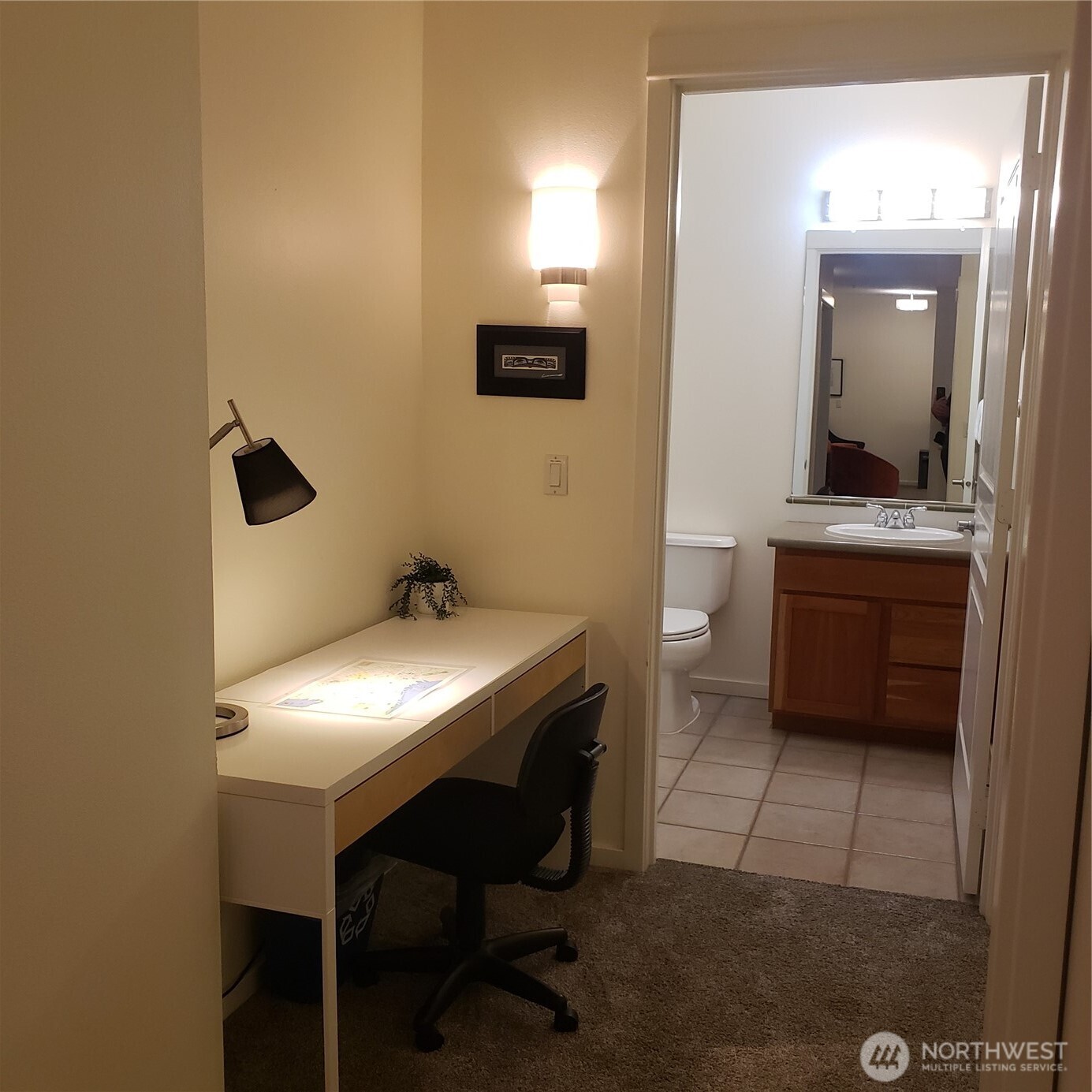 2000 Alaskan Way, Unit 342 Seattle, WA 98121 - Photo 26 of 40 a en suite bathroom with a toilet a sink and mirror