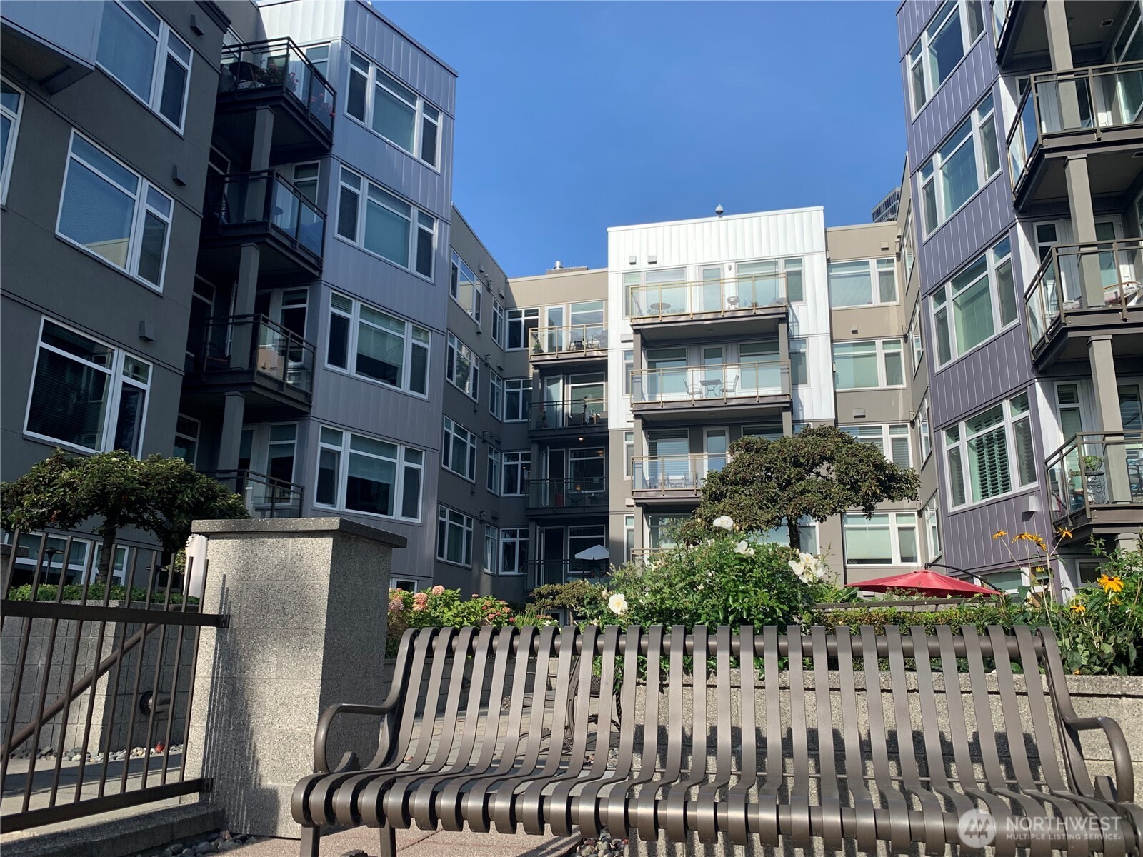 2000 Alaskan Way, Unit 342 Seattle, WA 98121 - Photo 3 of 40 a front view of a multi story building with yard