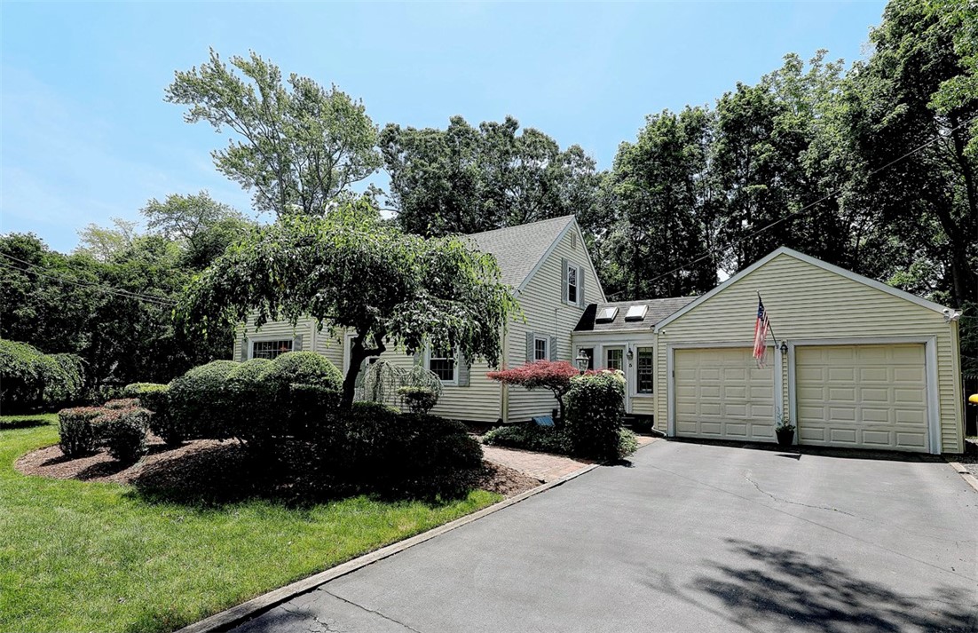 5 Surrey Road Barrington, RI 02806 - Photo 31 of 31 Large 2-car garage includes overhead storage and automatic door openers with exterior keypads.