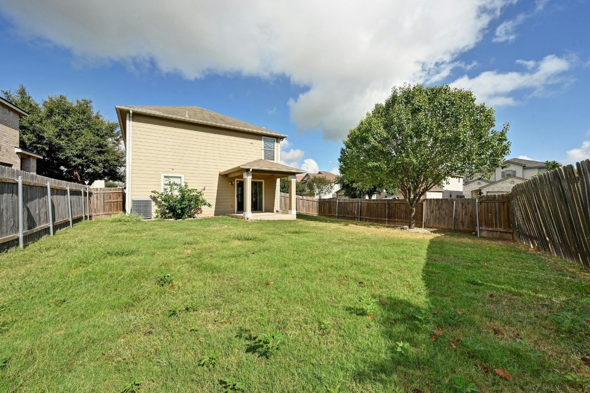 8901 Cornish Hen Cove Austin, TX 78747 - Photo 28 of 29 a front view of a house with yard and green space
