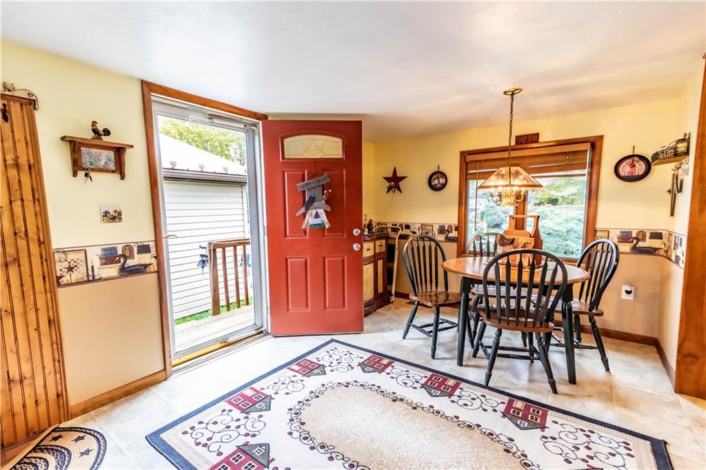 148 Locust Road Addison, PA 15411 - Photo 3 of 25 a view of a dining room with furniture window and wooden floor
