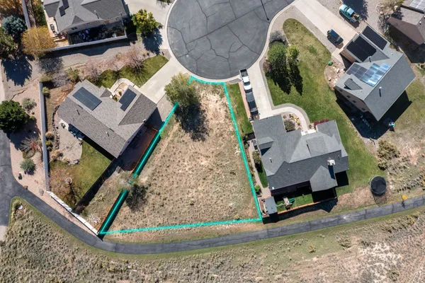 an aerial view of a house with a swimming pool