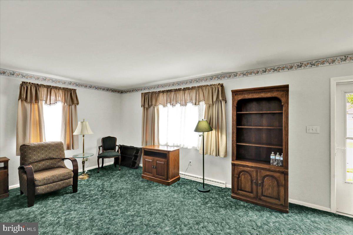 1224 Commonwealth Boulevard Reading, PA 19607 - Photo 5 of 27 a living room with furniture and a window