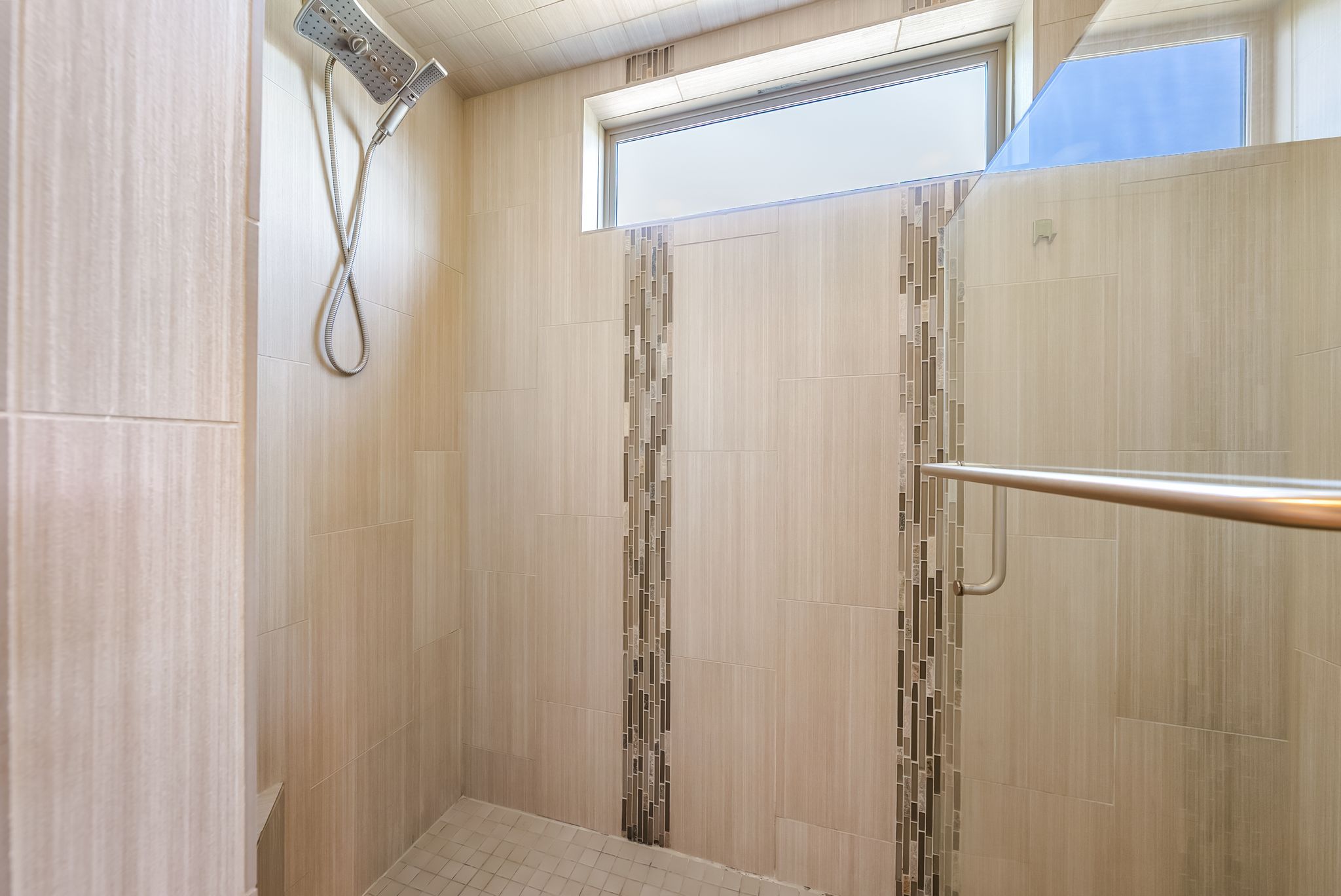 14213 Red Feather Trail Austin, TX 78734 - Photo 19 of 39 a bathroom with a glass shower door