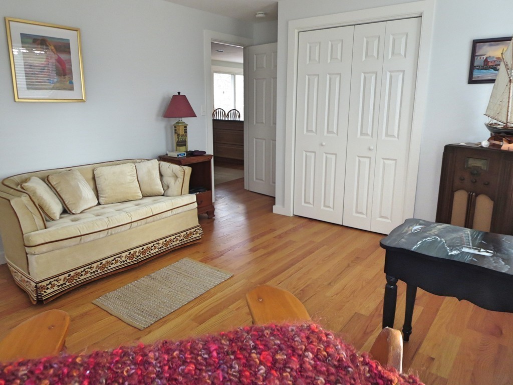 50 Wintergreen Road Mashpee, MA 02649 - Photo 14 of 30 a living room with furniture and a wooden floor