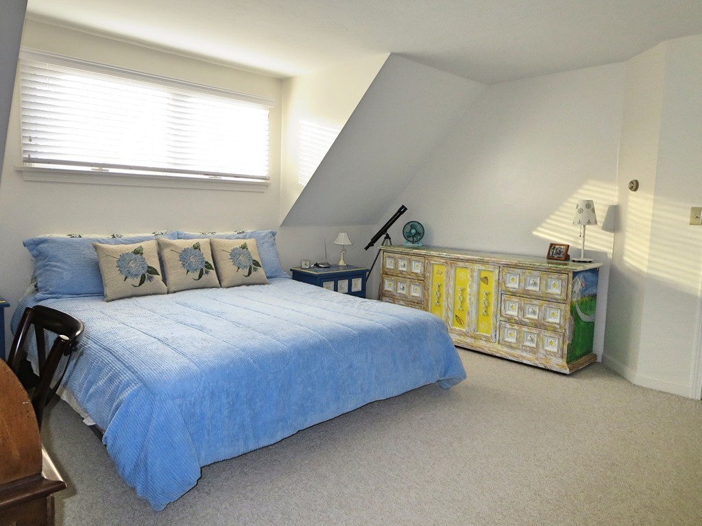 50 Wintergreen Road Mashpee, MA 02649 - Photo 18 of 30 a bedroom with a bed a window and dresser