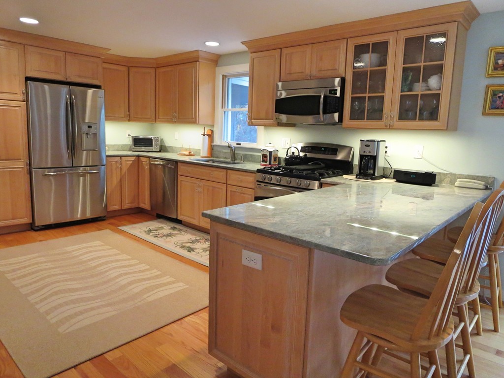 50 Wintergreen Road Mashpee, MA 02649 - Photo 2 of 30 a kitchen with granite countertop stainless steel appliances and wooden cabinets