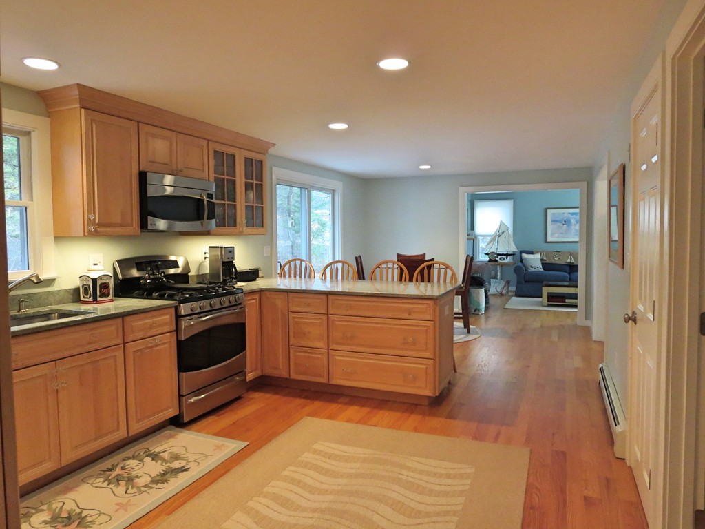50 Wintergreen Road Mashpee, MA 02649 - Photo 4 of 30 a kitchen with stainless steel appliances granite countertop a stove and a sink